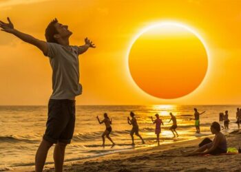 man is standing beach with sun background 1276840 24541
